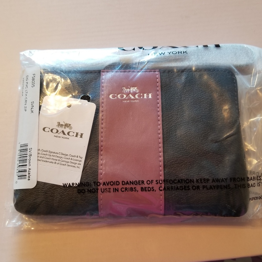 Coach signature wristlet NWT brown/azalea